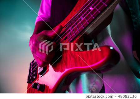 African American jazz musician playing bass guitar. African American jazz musician playing bass guitar. 49082136