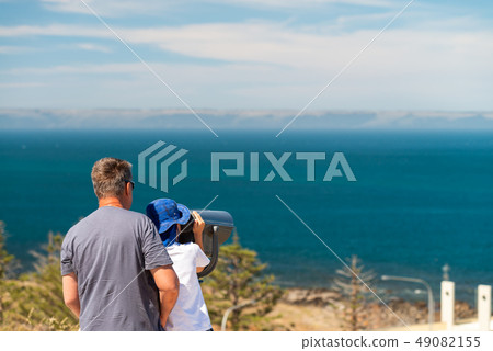 Grandfather and grandson observing Kangaroo Island Grandfather and grandson observing Kangaroo Island 49082155