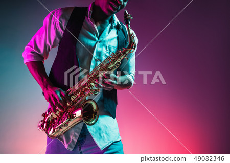 African American jazz musician playing the saxophone. African American jazz musician playing the saxophone. 49082346