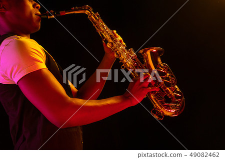 African American jazz musician playing the saxophone. African American jazz musician playing the saxophone. 49082462
