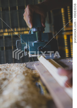 close up wood drill machine working  in home work 49083038