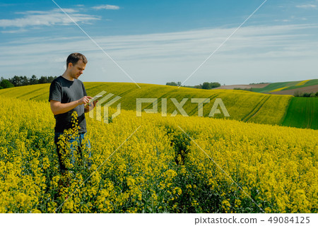 Farmer holding tablet 49084125