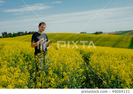 Farmer holding tablet Farmer holding tablet 49084131