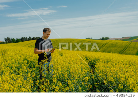 Farmer holding tablet Farmer holding tablet 49084139