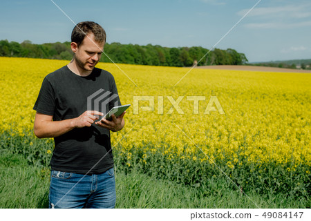 Farmer holding tablet Farmer holding tablet 49084147
