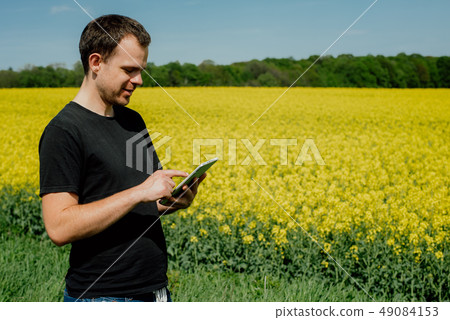 Farmer holding tablet Farmer holding tablet 49084153