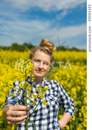 Farmer hold rape flower Farmer hold rape flower 49084165