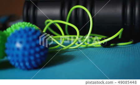 Massage ball roller for self massage, reflexology and myofascial release on blue Massage ball roller for self massage, reflexology and myofascial release on blue 49085448