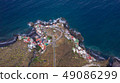 Top view of a coast. The buildings of the island 49086299