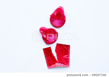 Red condom on white 49087346