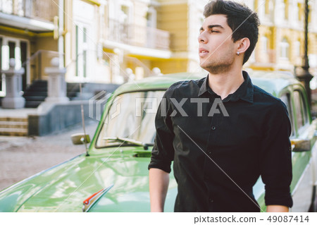 Portrait of a model young handsome sexy male brunette guy with dark skin Turkish Middle Eastern Portrait of a model young handsome sexy male brunette guy with dark skin Turkish Middle Eastern 49087414