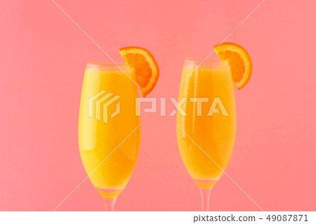 Yellow cocktail on a bright background. 49087871