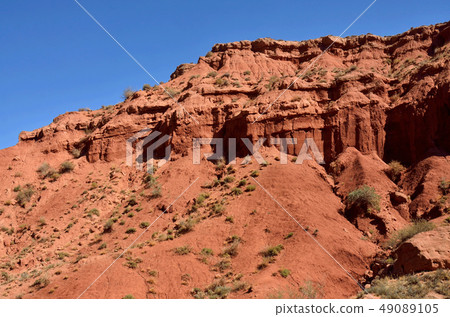 Red sandstone rocks of Konorchek canyon,Kirgyzstan 49089105