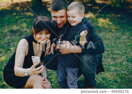 cute family in a park 49090276