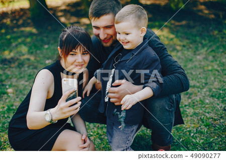 cute family in a park 49090277