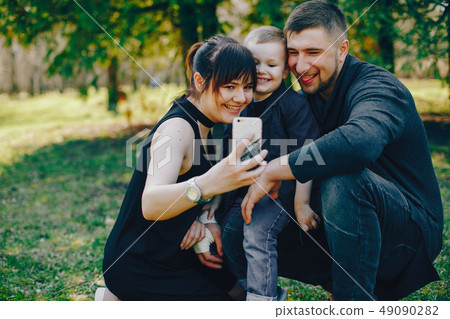 cute family in a park 49090282