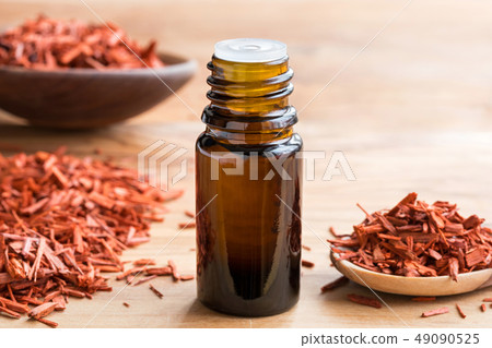 A bottle of sandalwood essential oil  49090525