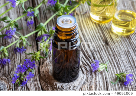 A bottle of hyssop essential oil with hyssop 49091009