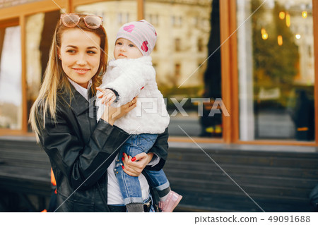 young mother with little daughter young mother with little daughter 49091688