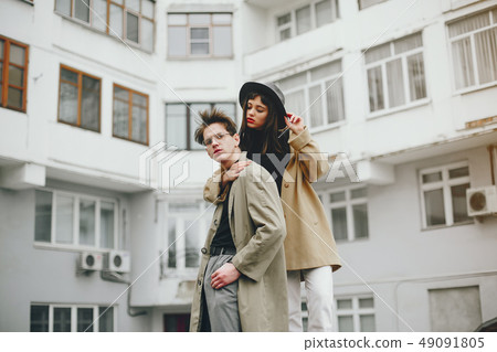 A trendy couple in a gloomy city 49091805