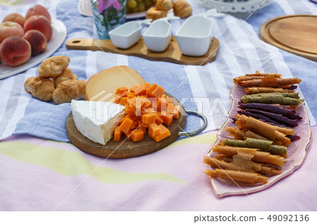 wooden tray with cheese assorti, pastillum rolls wooden tray with cheese assorti, pastillum rolls 49092136