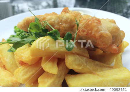 Traditional English food of cod fish and chips 49092551