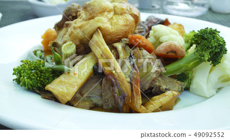 Plate of roast potatoes and root vegetables 49092552