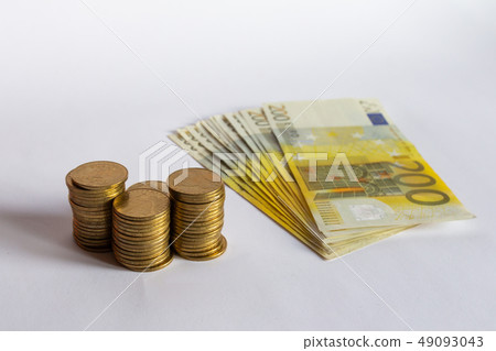 Coins and euro banknotes cash isolated on white Coins and euro banknotes cash isolated on white 49093043