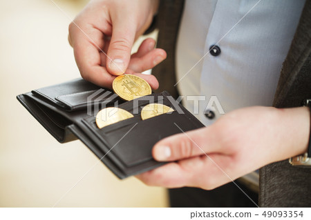 Bitcoin gold coin in wallet. Cryptocurrency concept Bitcoin gold coin in wallet. Cryptocurrency concept 49093354