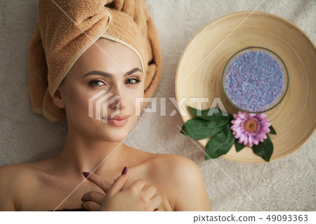 Masseur doing massage the head of an woman in spa salon Masseur doing massage the head of an woman in spa salon 49093363