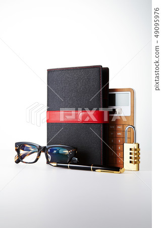 Diary, fountain pen, glasses, calculator 49095976