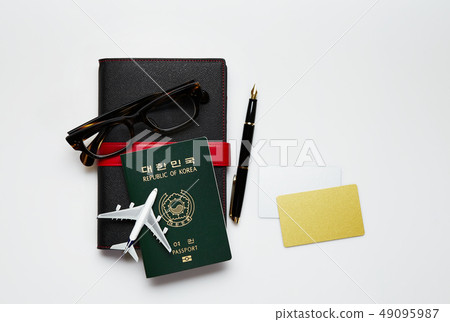 Passport, diary, fountain pen, glasses, airplane 49095987