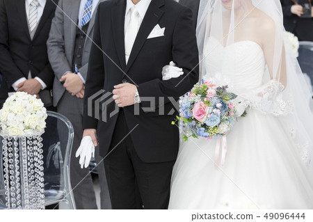 Father and bride wedding arms crossed 49096444