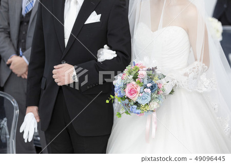 Father and bride wedding arms crossed 49096445