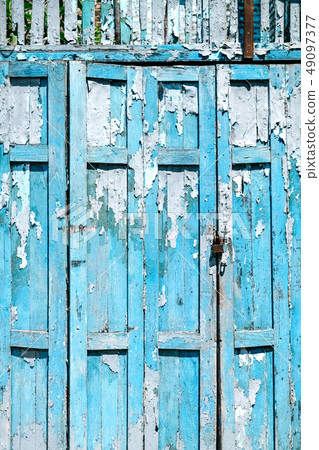 Old shabby blue wooden door  49097377