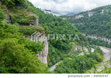 Skybridge suspension bridge over a gorge 49099547