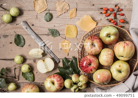 Red and green apples on vintage wooden table Red and green apples on vintage wooden table 49099751