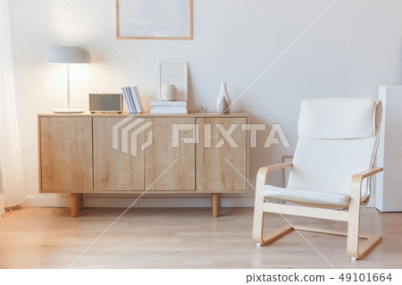 Living interior with cabinet and armchair 49101664