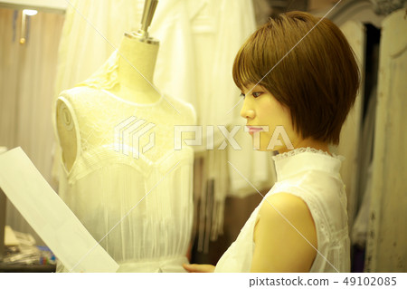 Woman making clothes 49102085