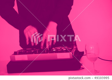 closeup hand Dj or disc jockey in party event pink 49103995