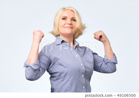 Elderly happy senior woman being proud of herself 49106500