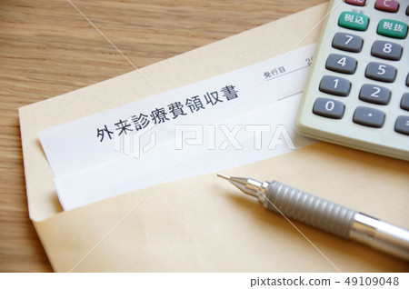 Envelope with calculator of medical expenses receipt and calculator and pen Envelope with calculator of medical expenses receipt and calculator and pen 49109048