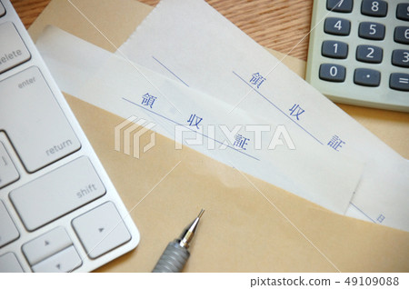 Receipt, calculator, keyboard and pen in an envelope 49109088