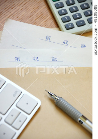 Receipt, calculator, keyboard and pen in an envelope Receipt, calculator, keyboard and pen in an envelope 49109089