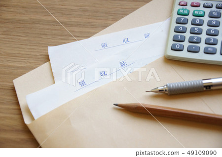 Receipt and calculator and pen in an envelope 49109090