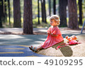 Sweet blond little baby girl in beautiful apricot 49109295