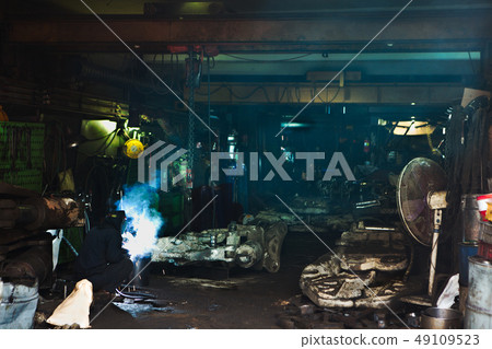 Technicians welding at ironworks Technicians welding at ironworks 49109523