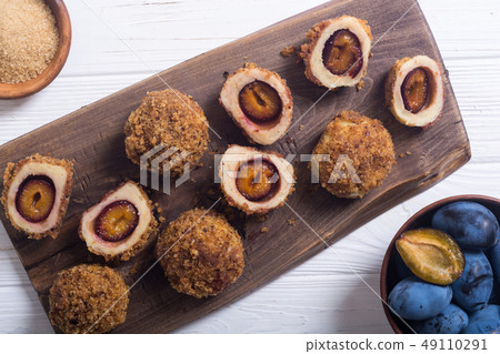 Traditional Austrian plum dumplings Traditional Austrian plum dumplings 49110291