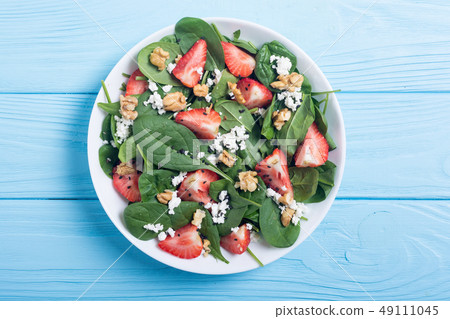 Strawberry salad with spinach , cheese and walnut Strawberry salad with spinach , cheese and walnut 49111045