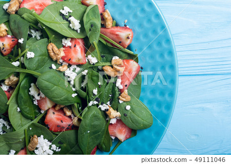 Strawberry salad with spinach , cheese and walnut Strawberry salad with spinach , cheese and walnut 49111046